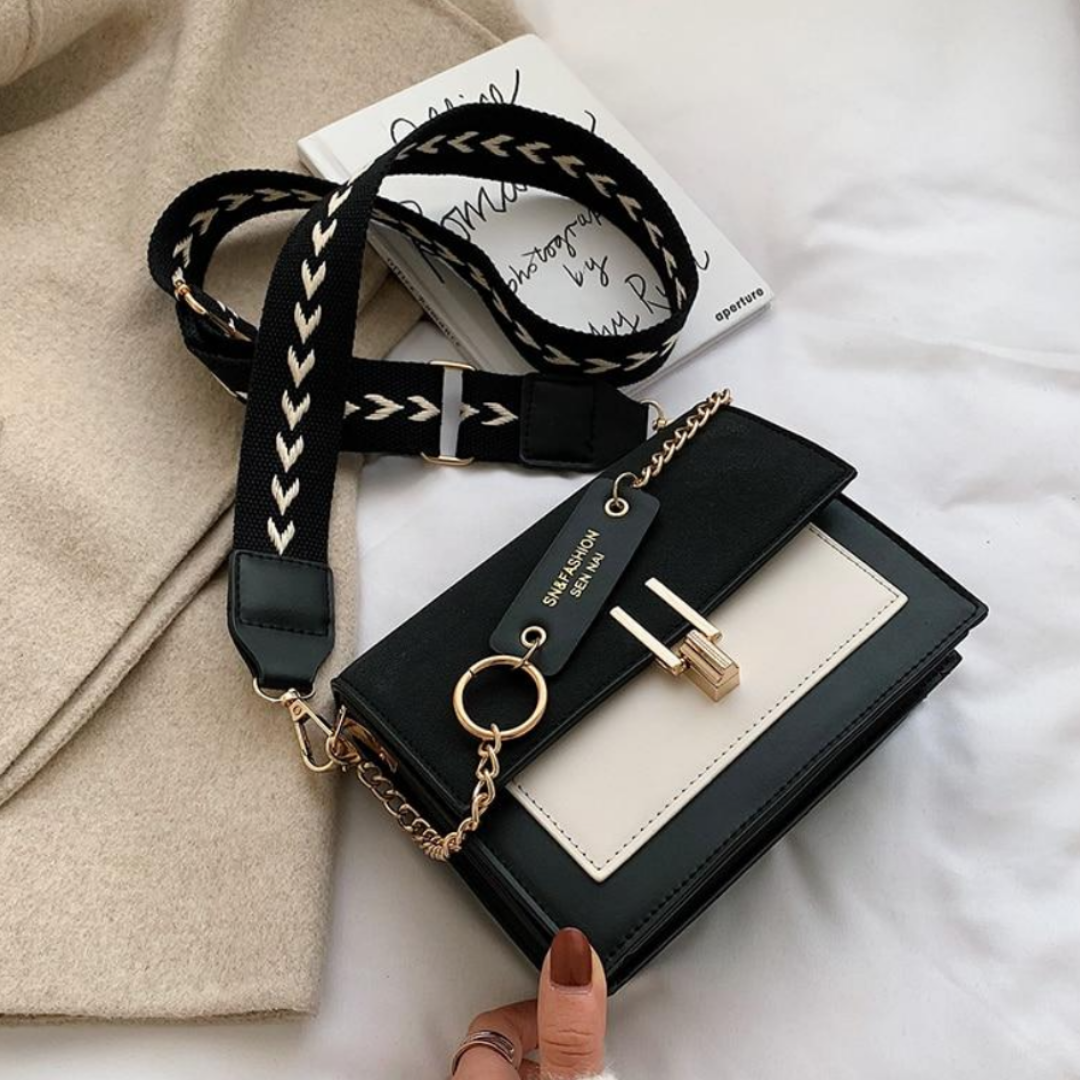 Dames Sana schoudertas in kunstleer, stijlvol en praktisch accessoire voor de zomer.