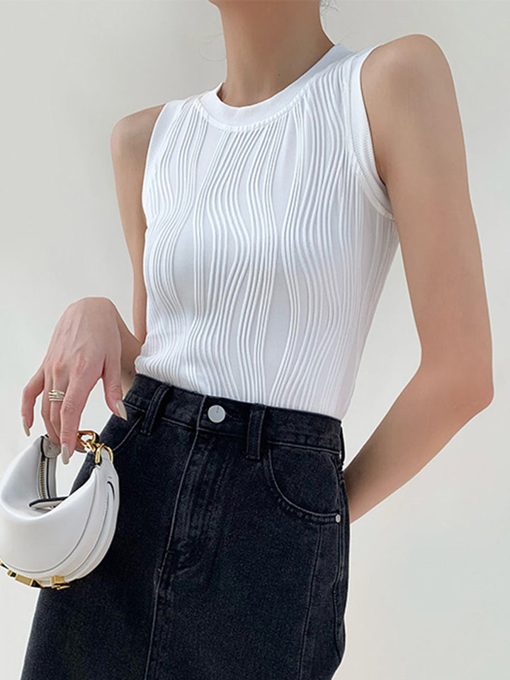 Dames slim fit tank top met golvende textuur. Mouwloos, comfortabel en ideaal voor de zomer.