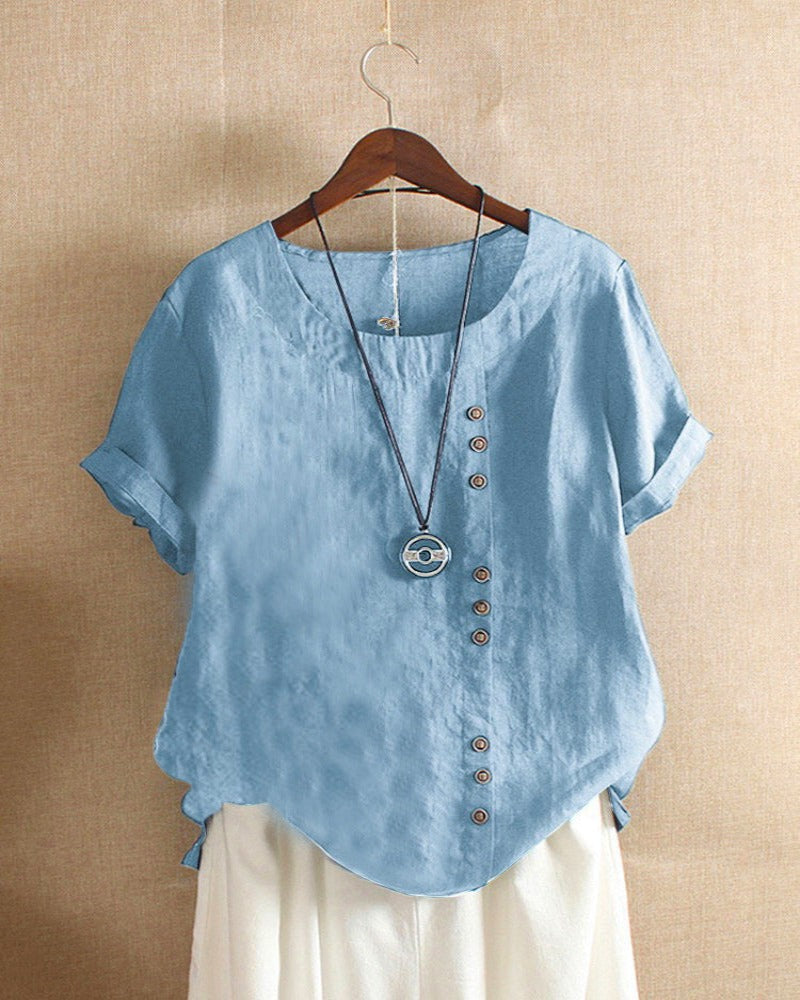 Dames top met korte mouwen en elegante knoopdetails. Ideaal voor lente en zomer, casual chic look.