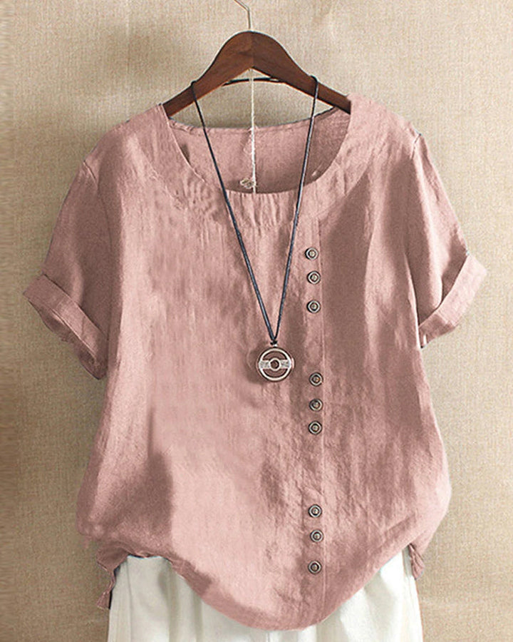 Zachte dames top korte mouwen, met elegante knoopdetails. Comfortabel, stijlvol en perfect voor lente/zomer mode.
