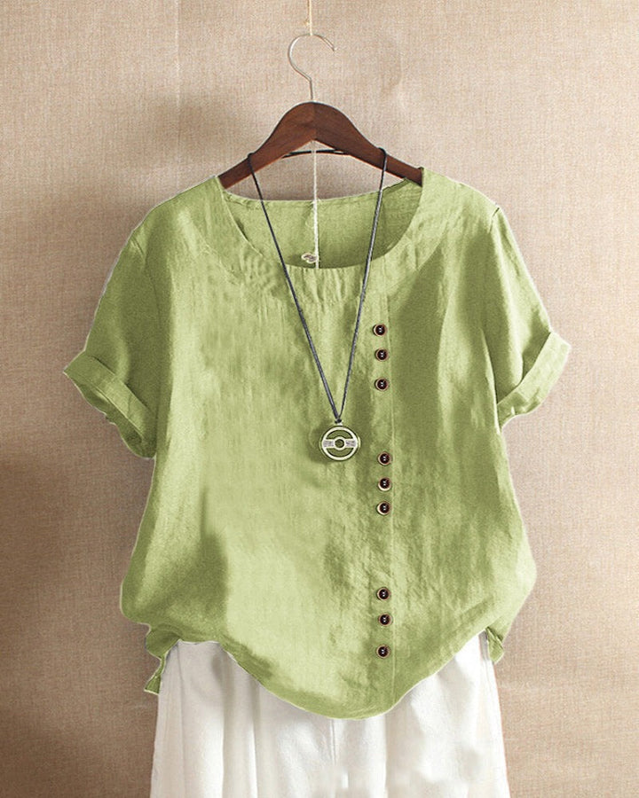 Elegante dames top met verfijnde knoopdetails, korte mouwen. Comfortabel en veelzijdig voor elke gelegenheid.