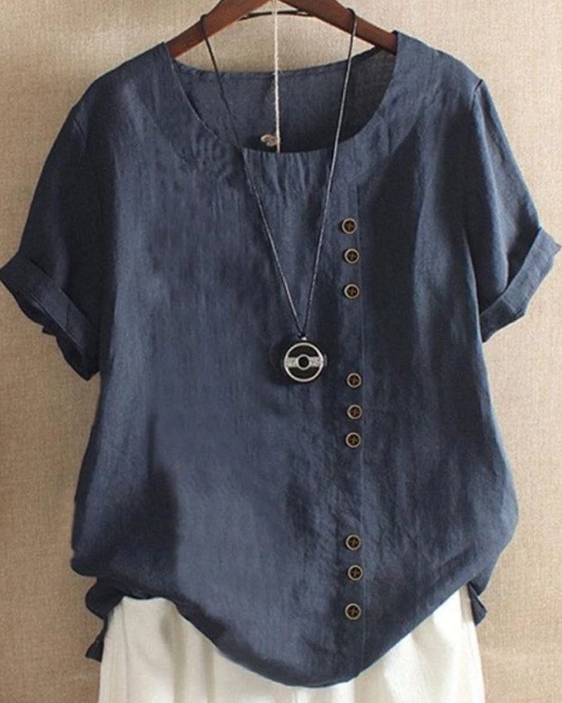 Stijlvolle dames top met korte mouwen en elegante knoopaccenten. Creëer een trendy en comfortabele outfit.