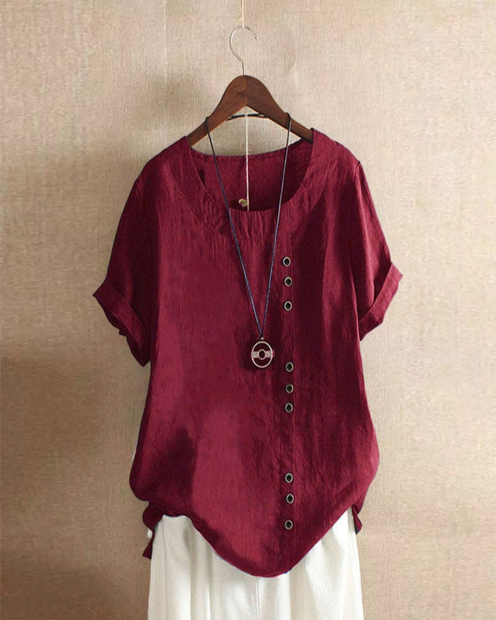 Casual chique dames top met korte mouwen en subtiele knoopdetails. Comfortabel en trendy voor lente en zomer.
