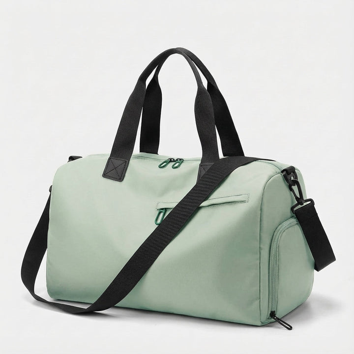 Ruime TrailGrip reistas duffel voor dames met apart schoenvak, waterbestendig en comfortabele schouderriem.