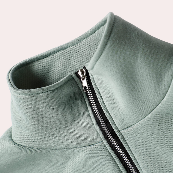 "Dames trainingspak met rits, groene top met hoge taille en losse pasvorm, comfortabel voor sport en casual gelegenheden."
