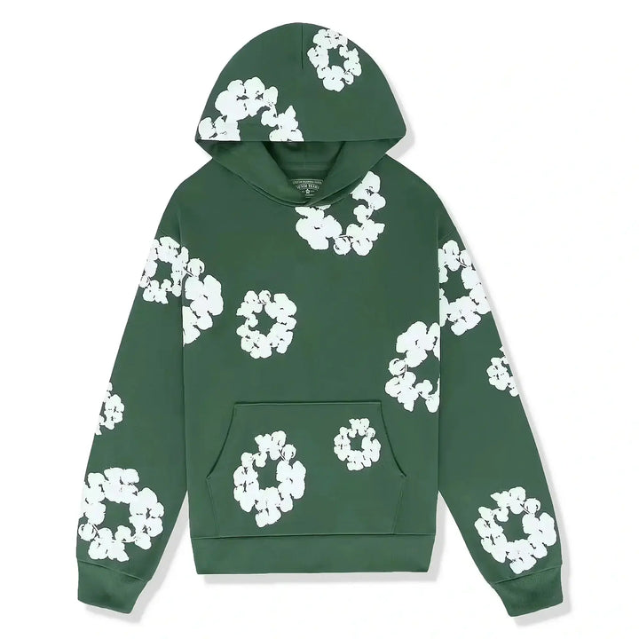 Close-up van de stijlvolle bloemdetails op de mouw van de Selvianne dames trainingsset hoodie.