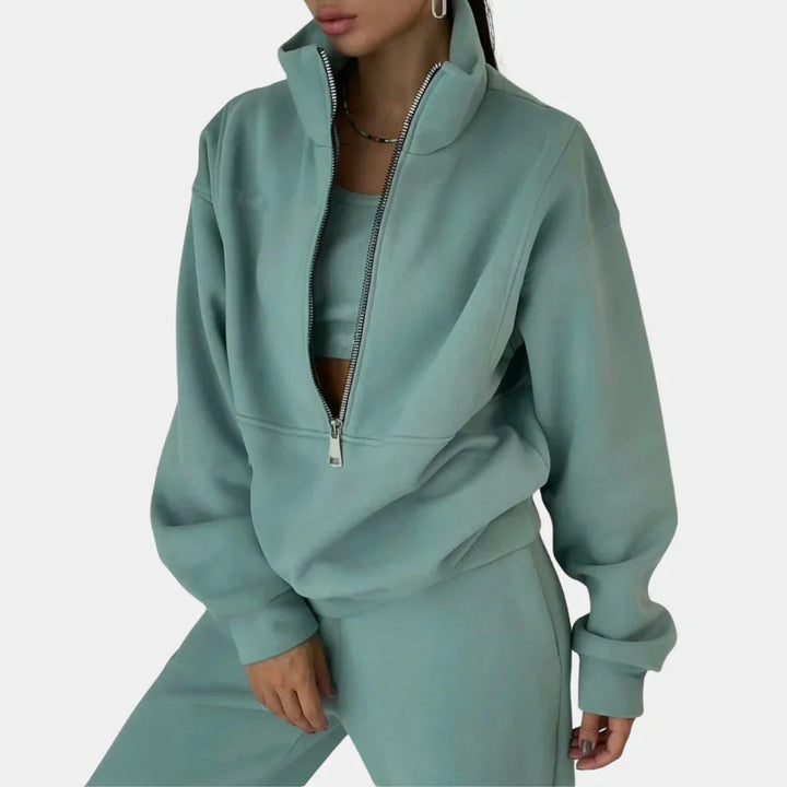 "Dames tweedelig trainingspak: elegante sweater, hoge taille broek, comfortabele pasvorm, ideaal voor casual stijl."