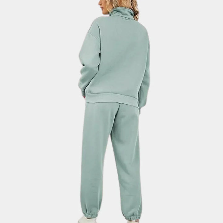 "Dames tweedelig trainingspak: elegante sweater, hoge taille broek, comfortabele pasvorm, ideaal voor casual stijl."