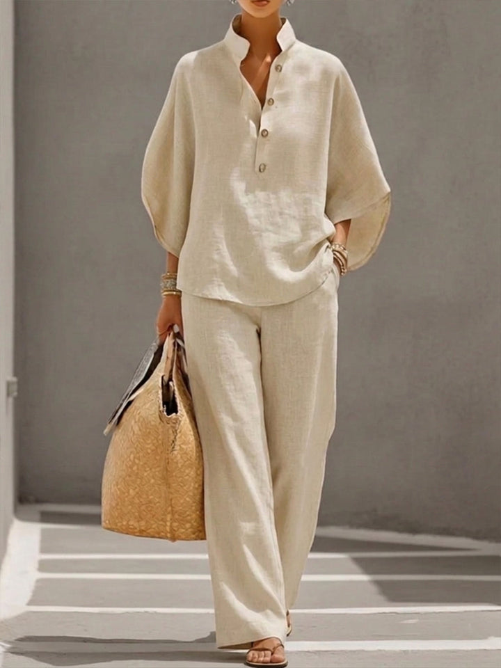 Dames tweedelige set met vleermuismouwen en comfortabele wijde broek. Casual chic lente/zomer outfit.
