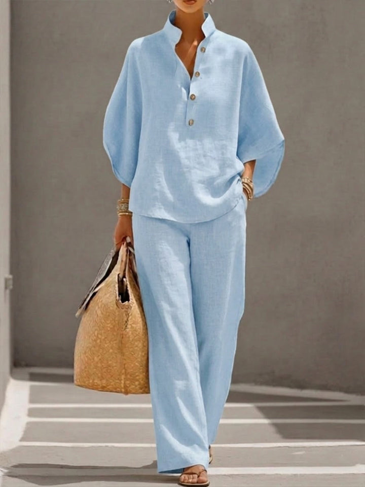 Elegante dames tweedelige set. Top met vleermuismouwen & minimalistische wijde broek. Perfect voor zomer.