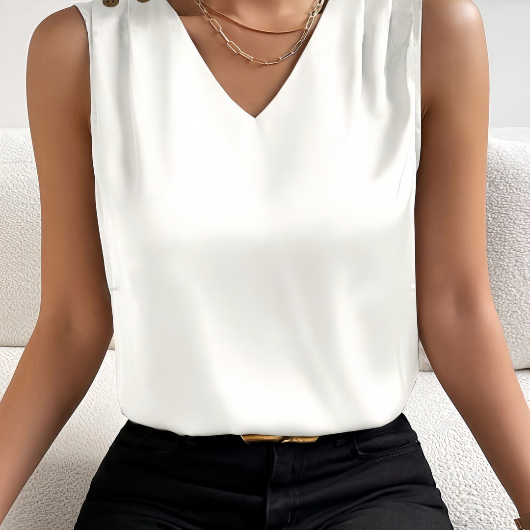 Elegante mouwloze zomertop voor dames met diepe V-hals en decoratieve knopen in diverse kleuren.