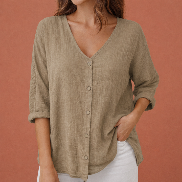 Dames V-hals T-shirt met knoopsluiting, driekwart mouwen. Casual, comfortabele losvallende blouse voor lente/zomer.