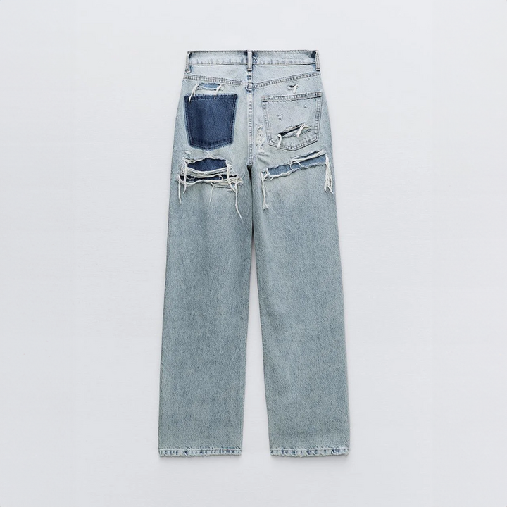 Achterkant van dames vintage ripped jeans met relaxte pasvorm, perfecte comfort jeans voor mode.