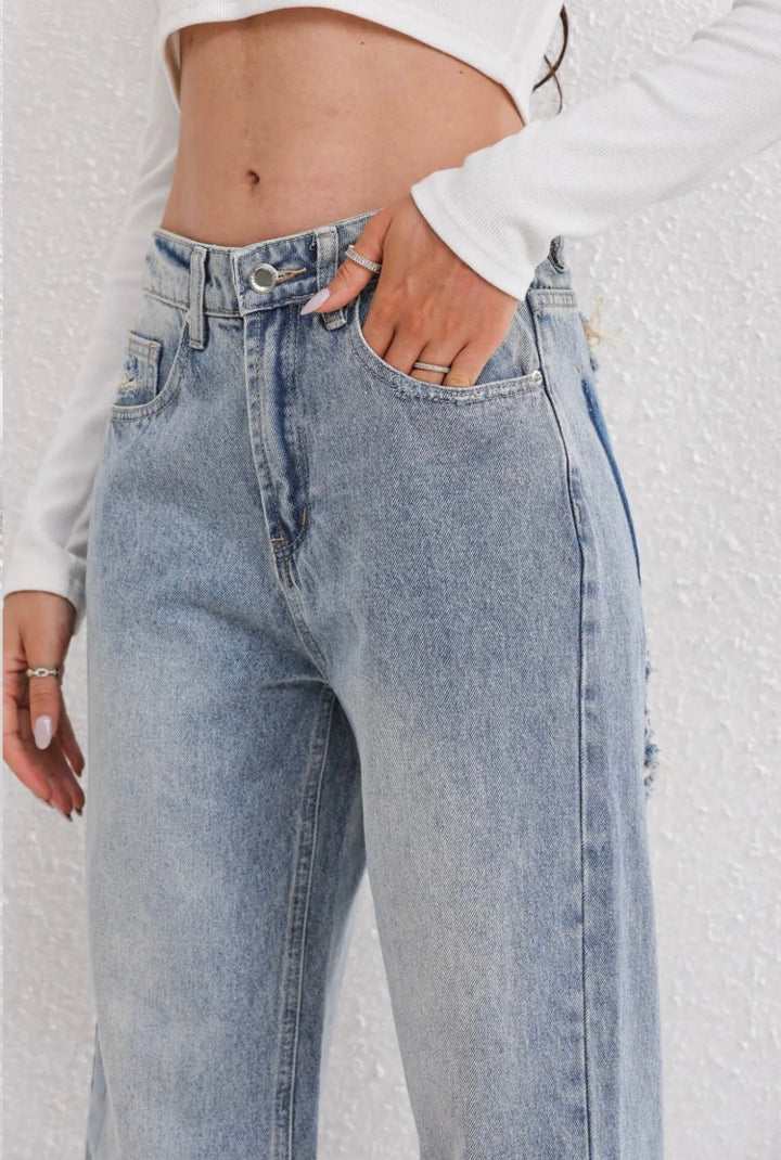 Grijze dames vintage ripped jeans met straight fit en relaxte pasvorm, perfect voor een casual look.