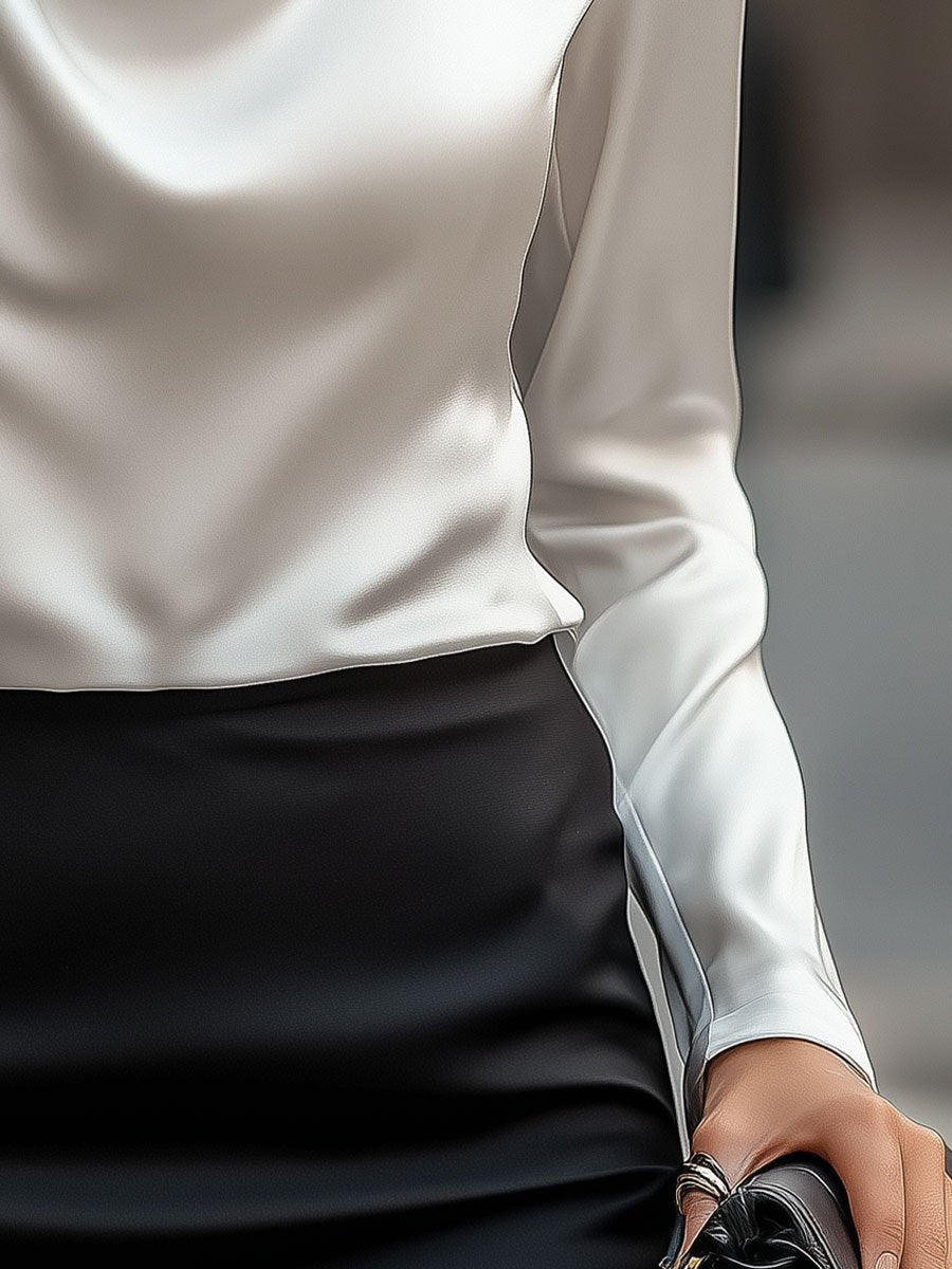Tijdloze elegante damesblouse, watervalhals design en lange mouwen voor een verfijnde look.