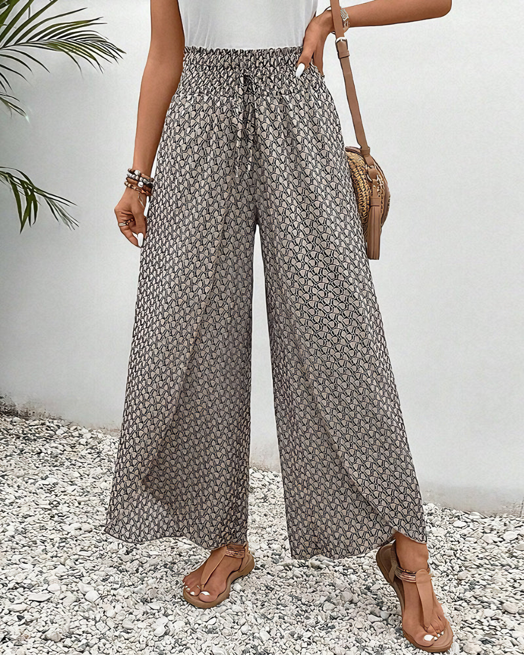 Dames wijde broek met geometrisch patroon, modieus en elegant, perfect voor een zomerse look.