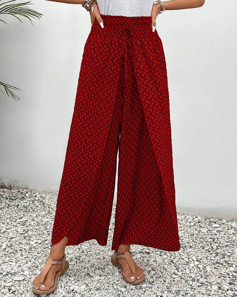 Geometrische patroonbroek voor dames met wijde pijpen, biedt een elegante en casual uitstraling.