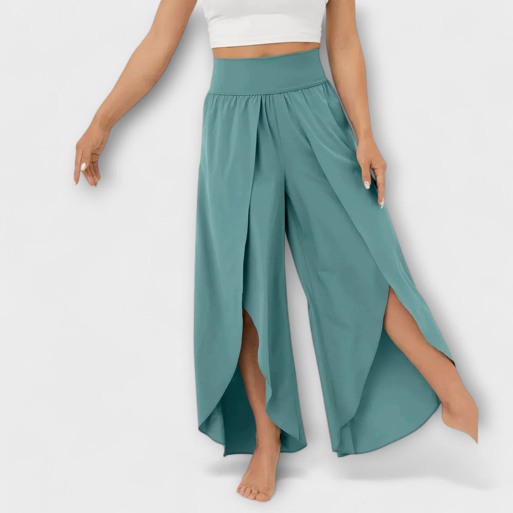 Trendy palazzo broek voor dames met wijde pijp, hoge taille en een luchtige zijsplit. Ideaal voor de zomer.
