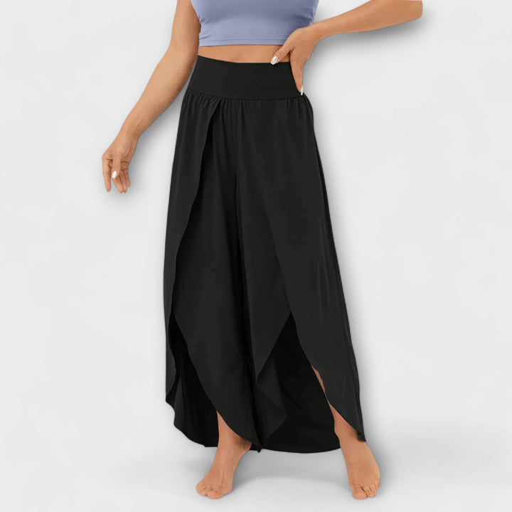 Dames palazzo broek: hoge taille, wijde pijp en een verfijnde zijsplit voor een chique en comfortabele zomer.