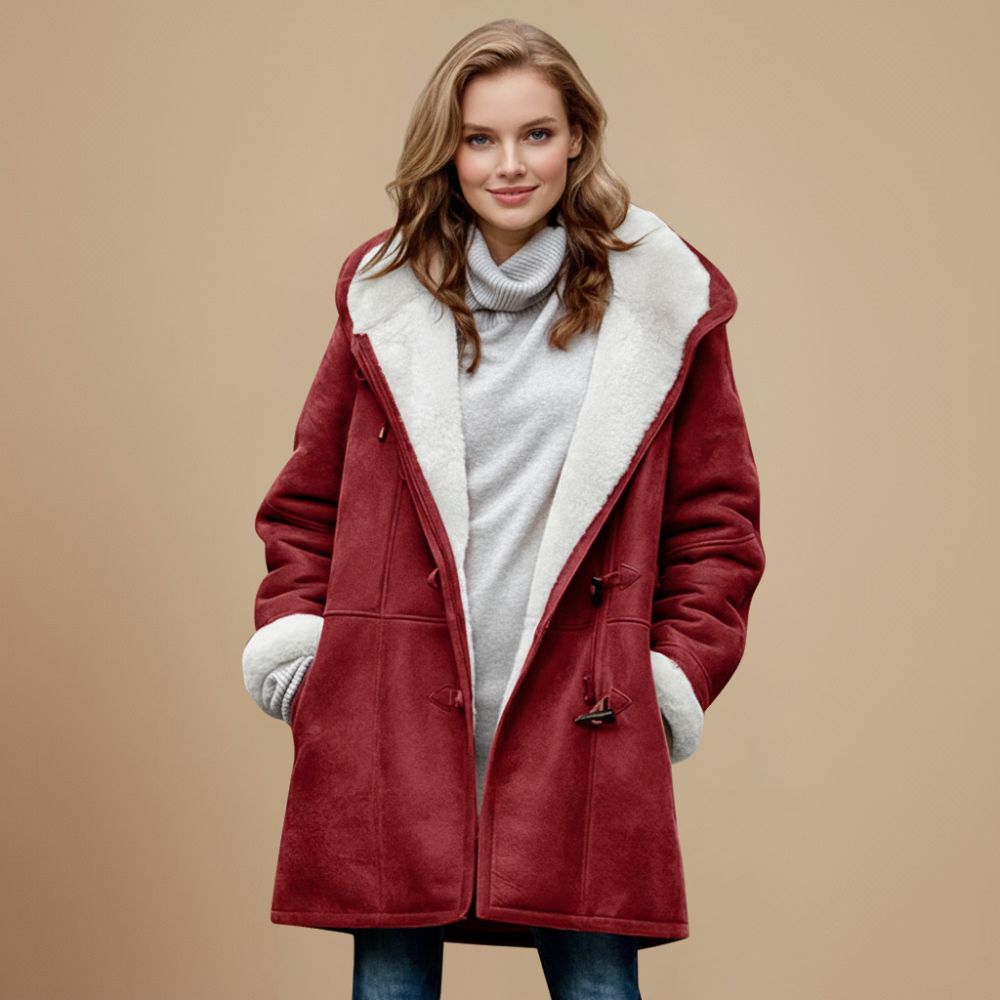 Dames winterjas met capuchon en toggleknopen. Comfortabele, elegante duffeljas perfect voor de winter.