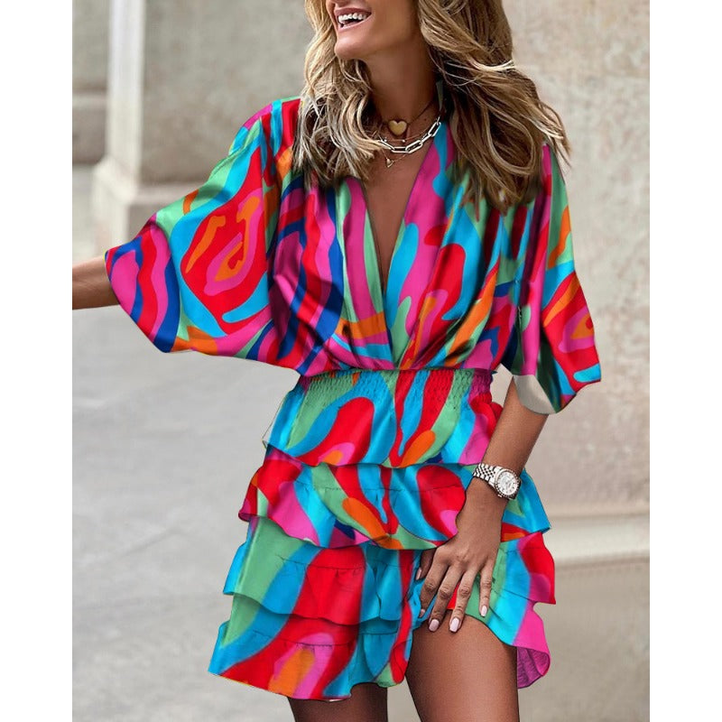 Dames zomerjurk met elegante V-hals, comfortabele vleermuismouwen en midi lengte voor een stijlvolle look.