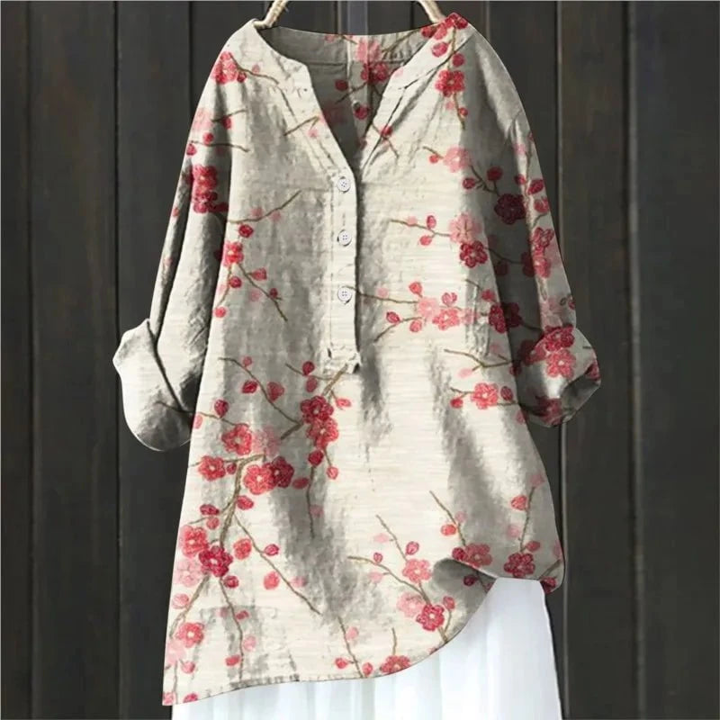 Bohemian chic damesblouse met levendige bloemenprint, V-hals en lange mouwen. Ideaal voor zomerse dagen.