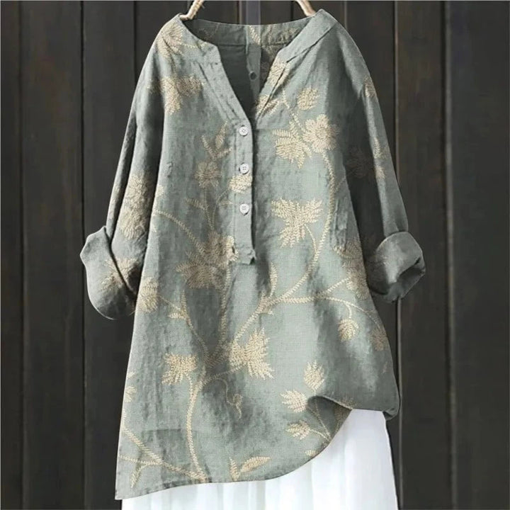 Stijlvolle damesblouse met V-hals en bloemenprint. Lange mouwen en een comfortabele pasvorm voor elke gelegenheid.