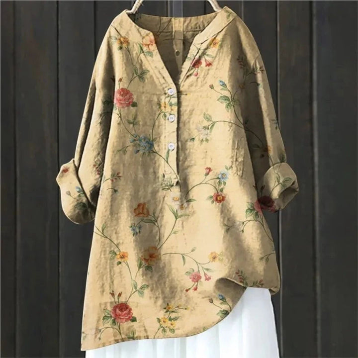 Modieuze damesblouse met frisse bloemenprint, V-hals en lange mouwen. Perfect voor een luchtige zomerse uitstraling.