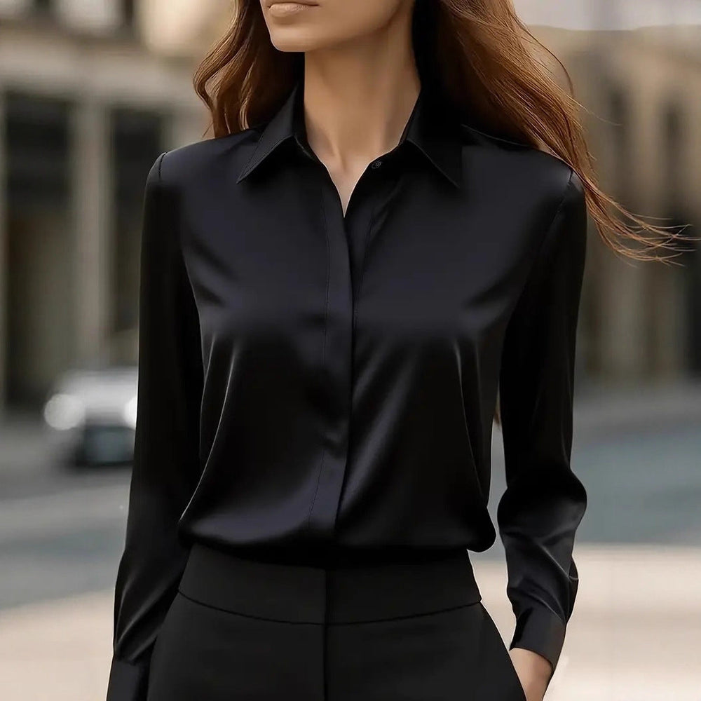 Modieuze damesblouse met lange mouwen, klassieke puntkraag en verborgen knoopsluiting; veelzijdig.