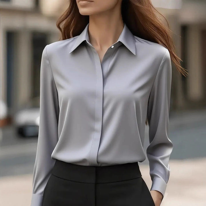 Elegante damesblouse met lange mouwen, klassieke puntkraag; perfect voor kantoor en casual outfits.