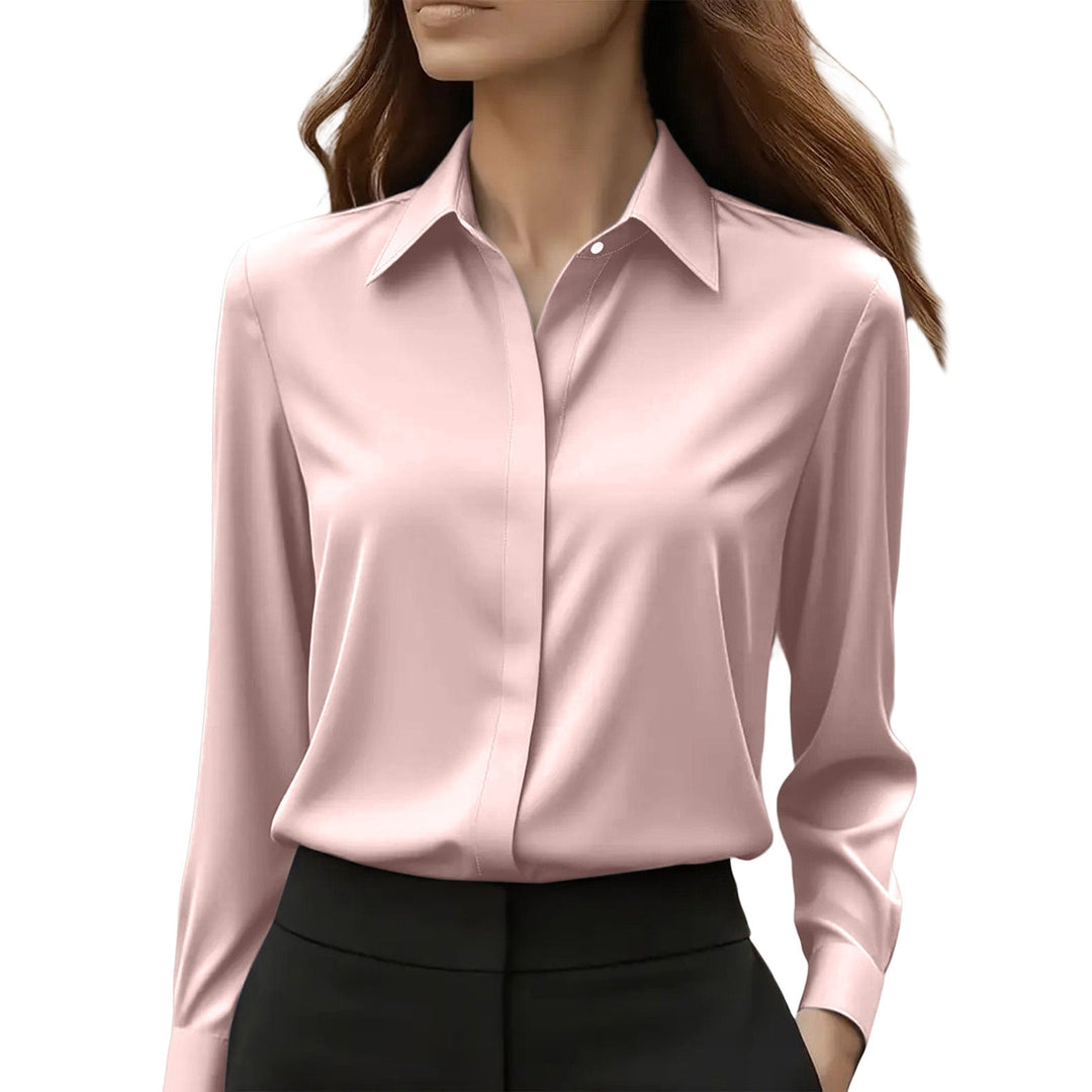 Klassieke damesblouse met lange mouwen, puntkraag en elegante, verborgen knoopsluiting; veelzijdig.