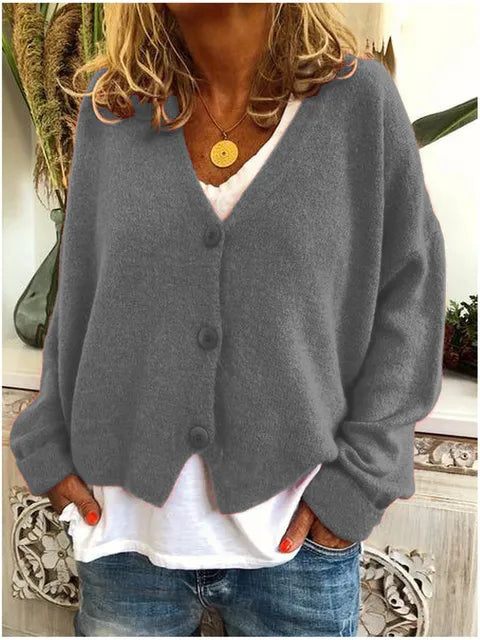 Dames V-hals trui cardigan, toont elegante pasvorm, knopen en comfortabele lange mouwen voor dameskleding.