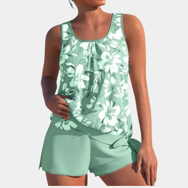 Elegant figuurcorrigerend zwempak Celestia voor dames, comfortabel en stijlvol, verkrijgbaar in groen en blauw.