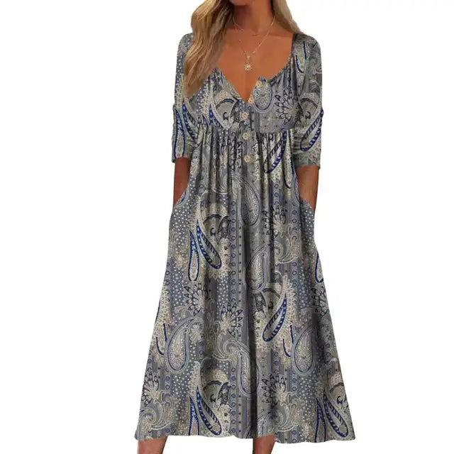 Elegante A-lijn midi jurk met levendige bloemenprint en praktische zakken, ideaal voor zomerse en stijlvolle dagen.