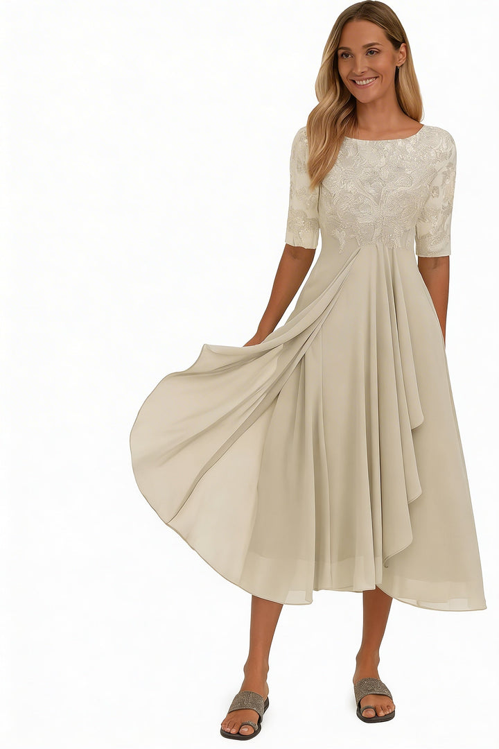 Elegante champagne midi jurk voor dames met sierlijk bovenstuk en zwierige rok, ideaal als feest- of galajurk.