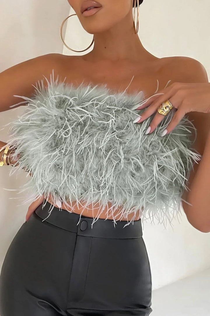 Trendy dames veren top, mouwloos en chique, ideaal voor feestjes.