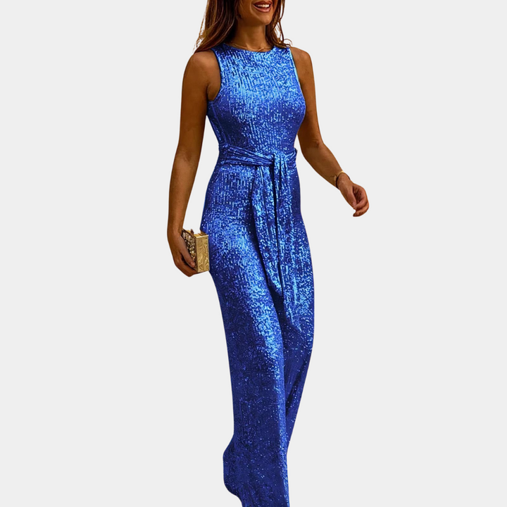 Model draagt een verfijnde dames glitter jumpsuit, perfecte avondkleding voor een stijlvolle en comfortabele look.