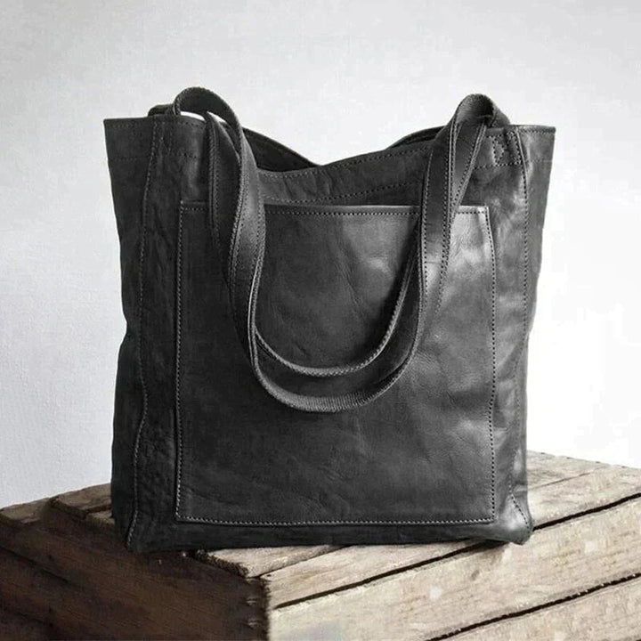 Bruine vegan leren dames schoudertas, ruim en elegant. Een praktisch en duurzaam accessoire voor elke vrouw.
