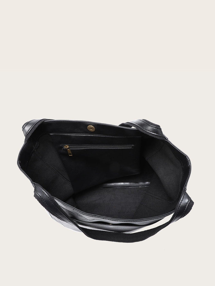 Moderne zwarte vegan leren dames handtas, ruim en elegant. Een modebewust en duurzaam accessoire voor de dame.