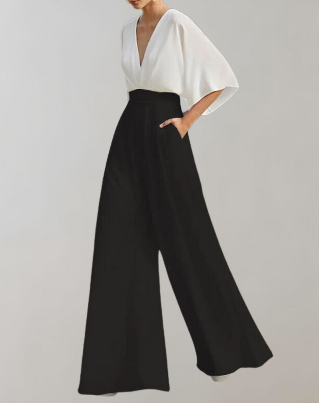 Makkelijk te dragen dames jumpsuit met wijde pijpen en diepe V-hals, elegant, comfortabel en modieus tegelijk.