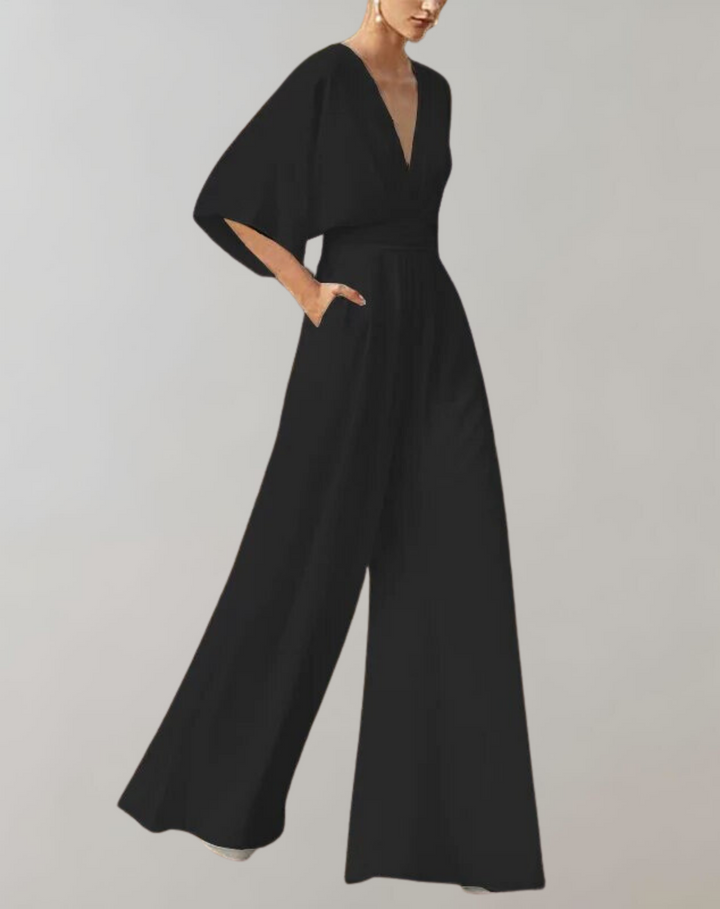 Trendy damesmode: stijlvolle jumpsuit met wijde pijpen, diepe V-hals, comfortabel en modieus voor elke gelegenheid.