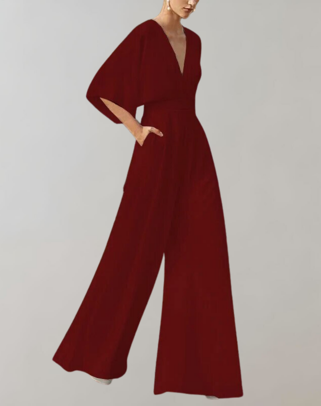 Flatterende dames jumpsuit met wijde pijpen en diepe V-hals, benadrukt een elegant silhouet, perfecte avondkleding.