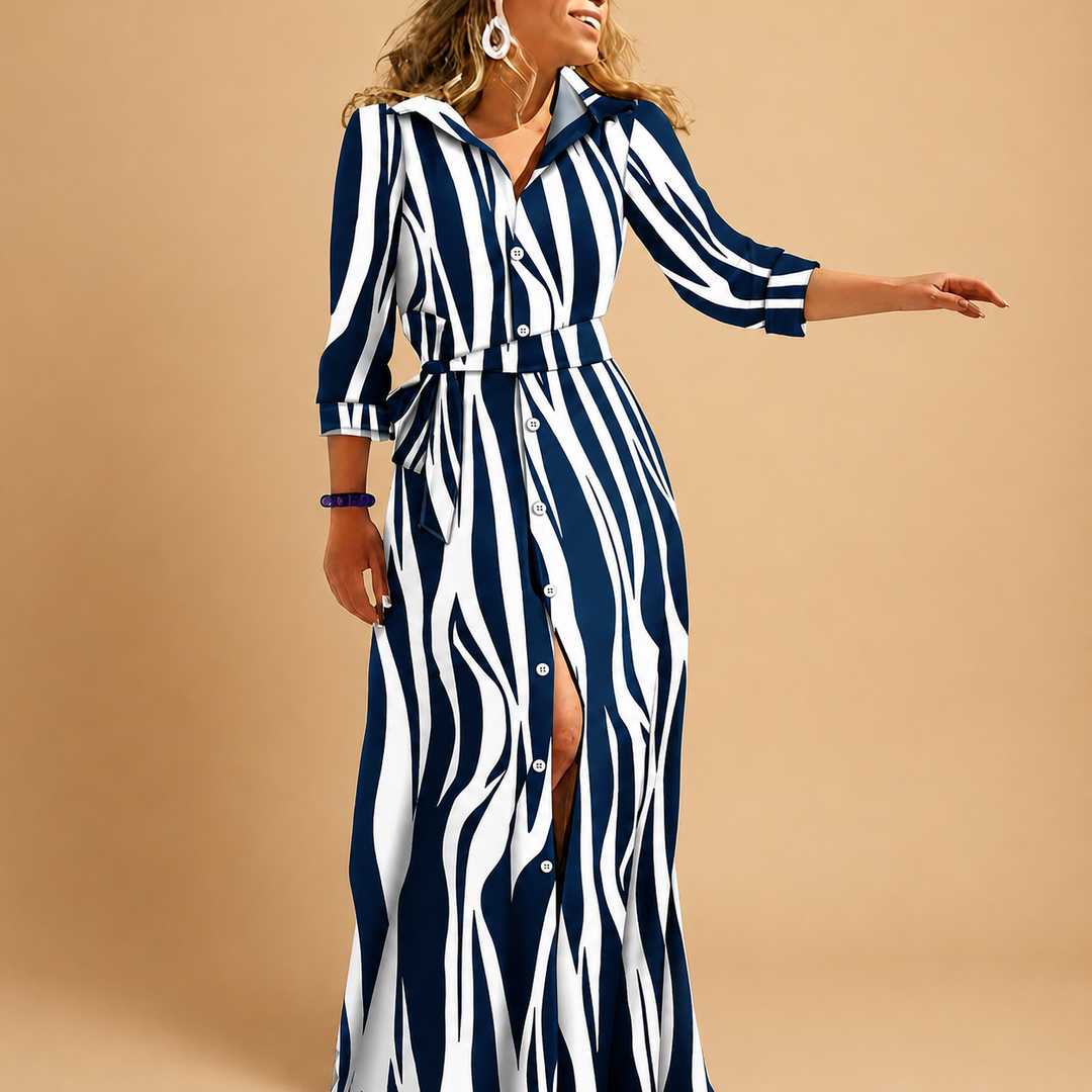 Veelzijdige dames jurk met lange snit, driekwart mouwen, kraag en strikceintuur. Een must-have voor vrouwenmode.