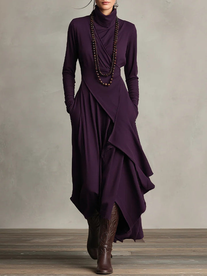 Stijlvolle maxi jurk voor dames met hoge col, lange mouwen en trendy asymmetrische rok. Ideaal voor feestjes.