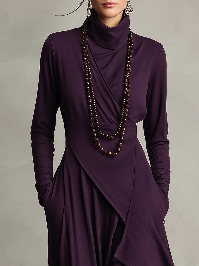 Casual dames jurk, maxi lengte, met hoge col en trendy asymmetrische rok. Veelzijdige en elegante jurk.