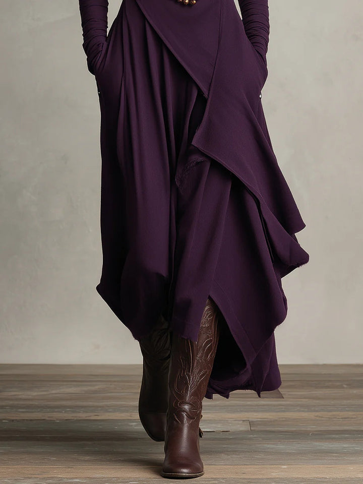 Dames kleding: Elegante maxi jurk met warme hoge col, lange mouwen en speelse asymmetrische rok. Trendy.
