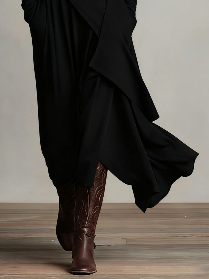 Lange jurk voor dames met hoge col, lange mouwen en modieuze asymmetrische rok. Perfecte pasvorm.