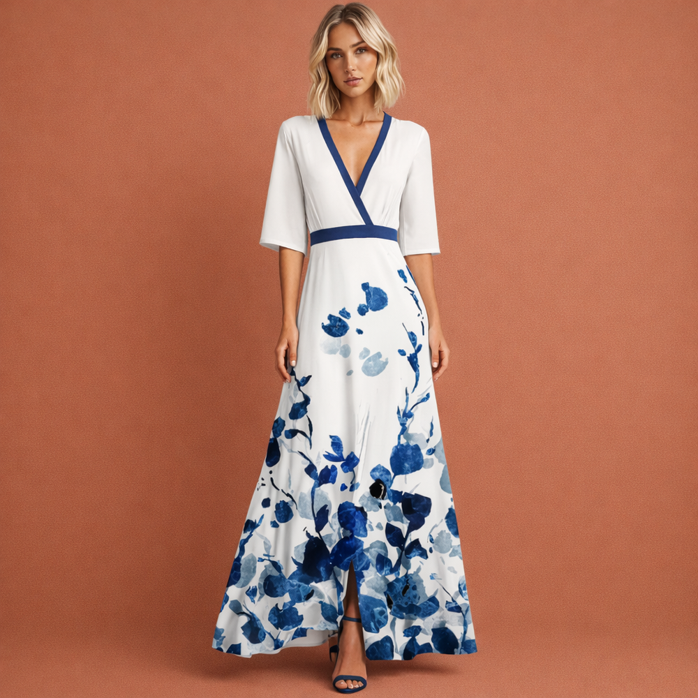 Lange dames zomerjurk met vrolijke bloemenprint en flatterende V-hals, ideaal voor vakantie of casual uitjes.