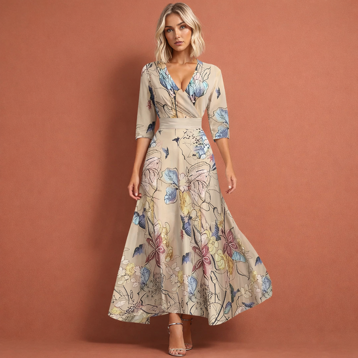 Chique dames maxi jurk met V-hals en kleurrijke bloemenprint, geschikt als feestjurk of casual lentemode.