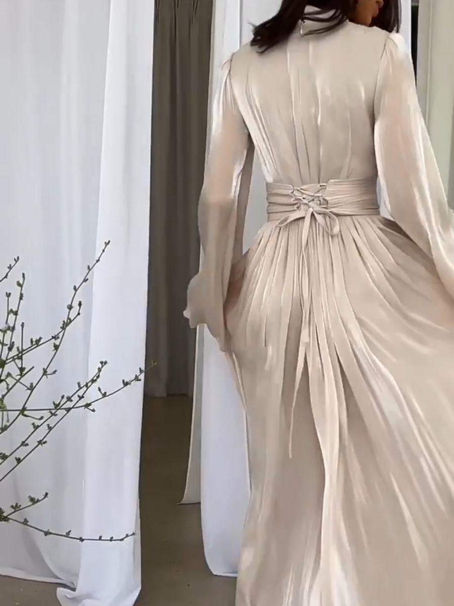 Comfortabele en elegante dames maxi jurk met strikceintuur, perfect als zomerjurk of voor feestelijke momenten.